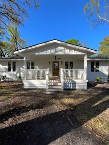 A large porch and updated entryway provide this modern home with the perfect home addition.